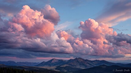 Pink clouds over mountains at sunset