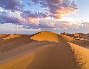 Dramatic desert dunes at sunset