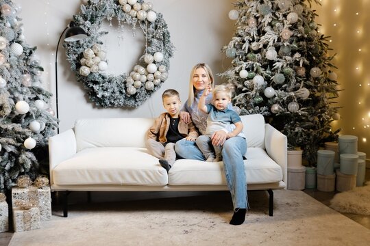 Mother posing with children for christmas photo
