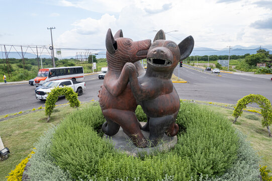 traffic circle of the dancing dogs, statue of Pre columbian Clay Dog Sculpture from Mexico, perritos bailarines, Colima, Mexico, October 2, 2024. colimotes, tlalchichis. artist Guillermo R&iacute;os Alcal&aacute;.