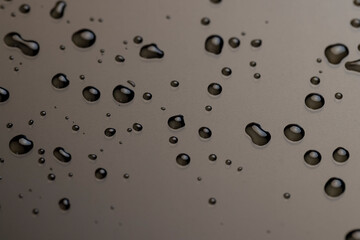 waterproof smooth surface completely wet, part of the phone screen is covered with drops of water, close up