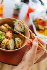Fresh street food, sushi rolls in tempura 