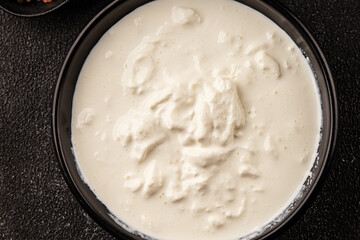 Stracciatella cheese soft young portion size Italian food natural product tasty snack fresh delicious gourmet food background on the table rustic top view copy space