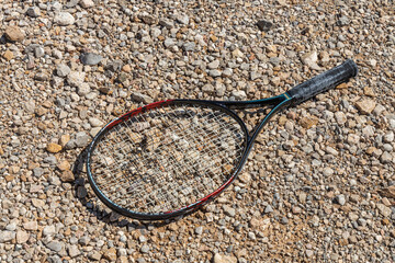 Tennis racket on the brown background