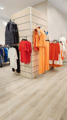 variety of dresses displayed on shelves and hangers