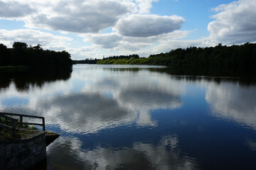 Serene Lake View with Cloudy Reflections at Clumber Park, Nottinghamshire, England: A Tranquil Countryside Landscape