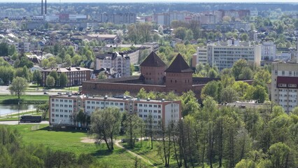 Obraz premium A medieval castle in the middle of a modern European city. An old fortress in the center of a metropolis.