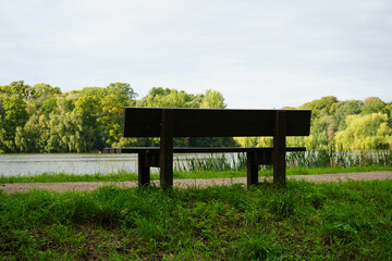 Empty Bench by the Lake at Clumber Park, Nottinghamshire, England: Peaceful Countryside Scene