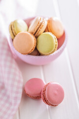 Different flavors of macarons. Colourful macaroons on white table.