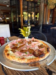 Pizza with ham and mushrooms on plate