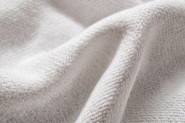Soft, light-gray fabric folds