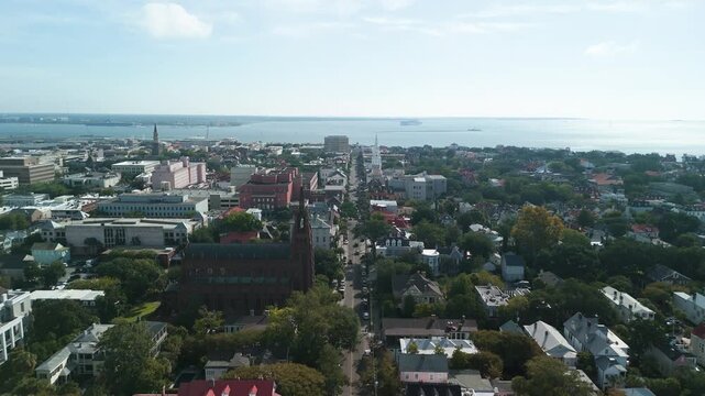 Charleston South Carolina city drone shot during the day flying down broad street towards four corners