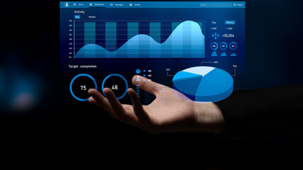 A hand reaches toward a digital interface displaying colorful data metrics and charts, symbolizing technology, analytics, and progress in business environments. Impute