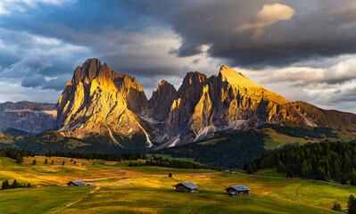 The UNESCO site Seiser Alm or Alpe di Siusi the Dolomite plateau and the largest high-elevation Alpine meadow  in Europe located in Italy's South Tyrol province in the Dolomites in autumn sunset.