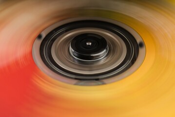 Abstract spinning disc with red and yellow motion blur background