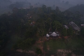Exploring a remote village in the Amazon rainforest during twilight