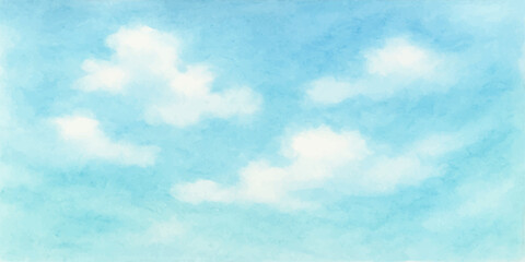 Fluffy white clouds drift across a bright blue sky on a clear summer day