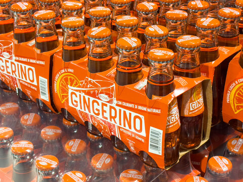 Gemona, Italy - September 24, 2025: Gingerino soft drink bottles arranged in a vibrant display, showcasing the bright orange packaging and refreshing beverage concept for consumers