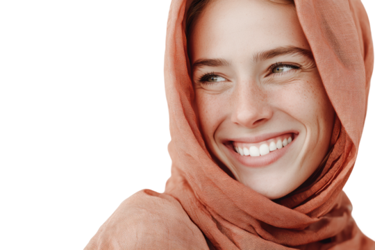 Smiling young caucasian woman in orange hijab with freckles and bright eyes, cut out