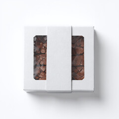 box with white ribbon for brownie on white background