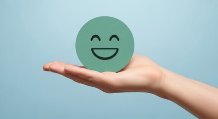 Hand holding adorable green smiling face on pastel background, conveying happiness, positivity and excellent feedback, ideal for customer service concepts