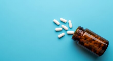 Boost your health with vitamins and supplements spilling from a bottle, promoting wellness and a balanced lifestyle on a calming blue background
