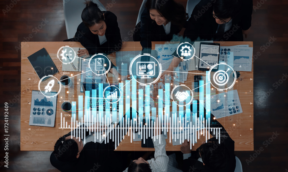 Poster professionals collaborate during a business meeting, analyzing data insights through graphs and char