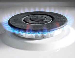Close-up of a gas stove burner with flames