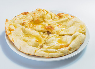 Sweet Honey Naan in plate side view of Fluffy Indian Flatbread Drizzled with Golden Honey on white background