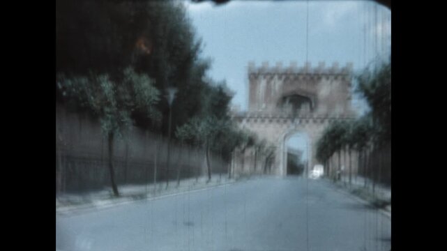 Porta Romana in Siena 1964 - First person view from a car as it approaches Porta Romana, one of the portals in the medieval walls of Siena, Italy, in 1964.