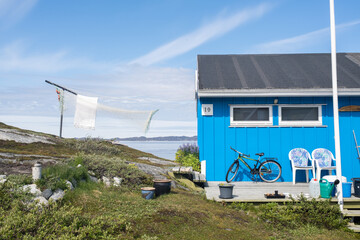 Blue House with Bicycle in Nuuk Greenland by the Arctic Sea © Gabriel Latis