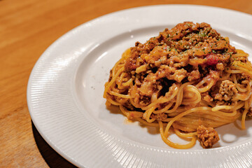 Spaghetti Bolognese pasta with meat sauce on plate
