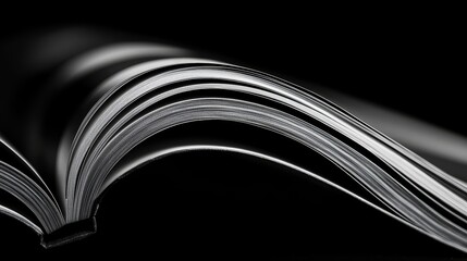 Book is open to a page with a black background. The book is a hardcover and the pages are white