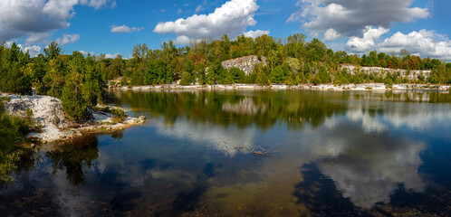 Panoramic landscape of limestone bluffs reflected in the lake at Klondike Park near Augusta in St. Charles County Missouri 