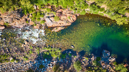 Aerial Merced River Rocky Shore and Green Forest Top Down View