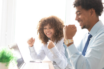 young business couple in the office with successful expression
