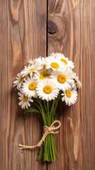 Obraz premium A bouquet of daisies sits on a rustic wooden surface