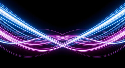 Fototapeta premium Abstract light trails in blue and purple on a black background.