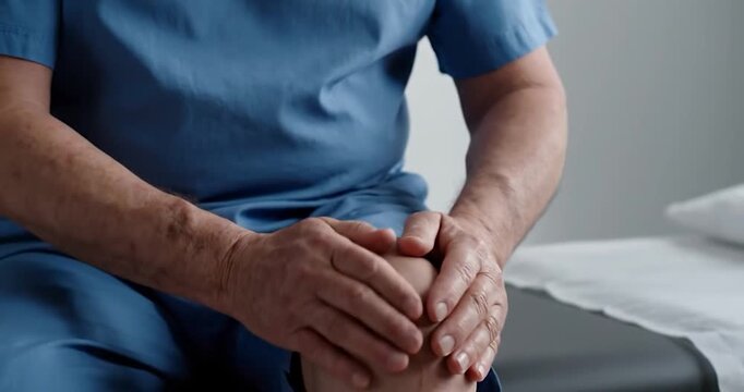 Senior Man Massaging Painful Arthritic Knee. Rheumatoid arthritis. - Powered by Adobe