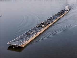Set of liquid cargo barges being pushed North up the Mississippi River