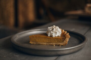 Homemade Pumpkin Pie with Whipped Cream Slice on Plate, Autumn Dessert