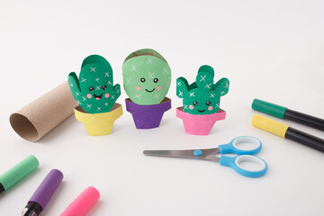 Creative cactus characters made from recycled toilet paper rolls for kids content, parenting blogs, sustainable lifestyle media, DIY tutorials, and early education activities © Elena