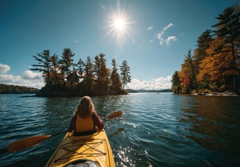 Kayaker on a lake with autumn foliage