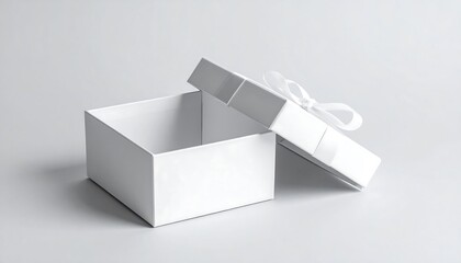 Opened white gift box on a light gray surface