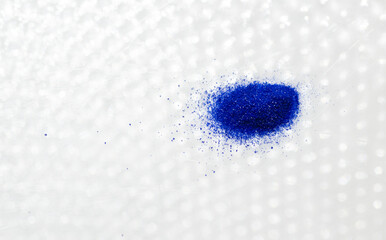 Close up of Blue Copper Peptides in Powder and Liquid Form