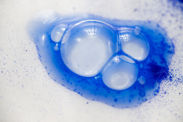 Close up of Blue Copper Peptides in Powder and Liquid Form