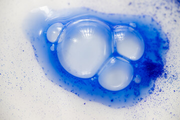 Close up of Blue Copper Peptides in Powder and Liquid Form