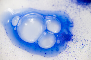 Close up of Blue Copper Peptides in Powder and Liquid Form
