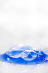 Close up of Blue Copper Peptides in Powder and Liquid Form