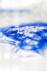 Close up of Blue Copper Peptides in Powder and Liquid Form